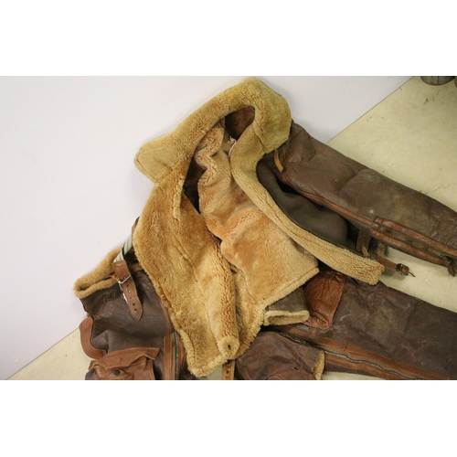 474A - RAF leather flying suit to include trousers, jacket, and two flying helmets.