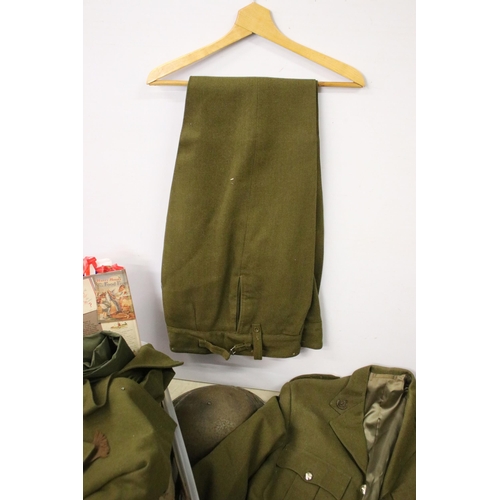 476 - Collection of militaria to include a no. 2 dress uniform, helmet, baby's gas mask.