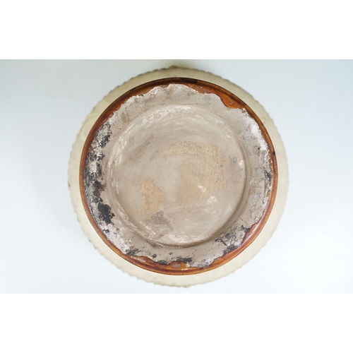 132 - 19th century majolica pedestal bowl, the bowl decorated with horned masks and putti, raised on colum... 