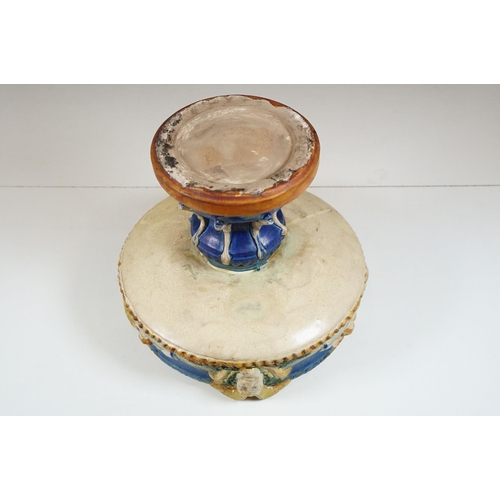 132 - 19th century majolica pedestal bowl, the bowl decorated with horned masks and putti, raised on colum... 