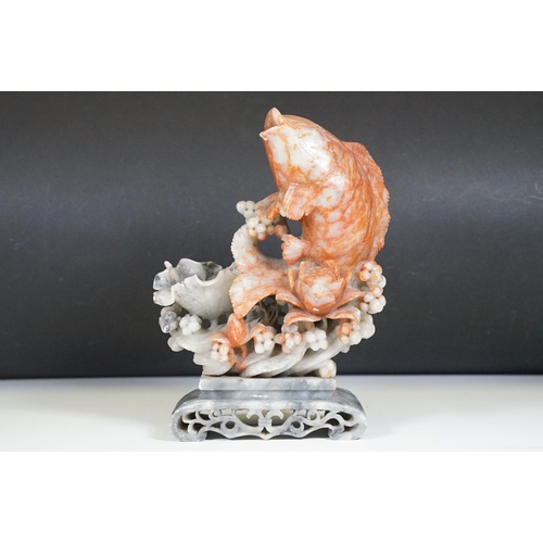 134 - Chinese carved soapstone sculpture of a leaping carp, measures 29cm tall