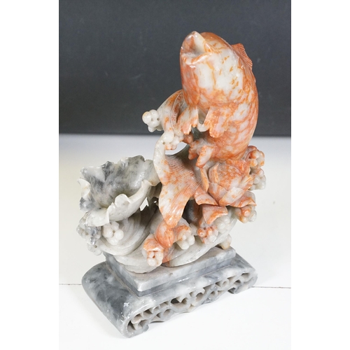 134 - Chinese carved soapstone sculpture of a leaping carp, measures 29cm tall