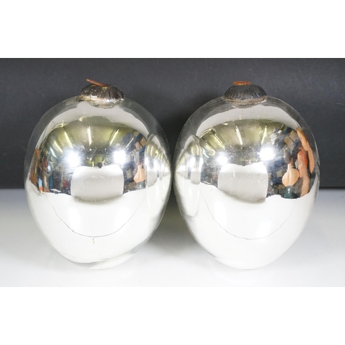 135 - Pair of large Christmas baubles / witches balls, with metal loop handles, measure 23cm tall