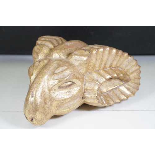 136 - Gilt wooden carved model of a rams head, measures 35cm long