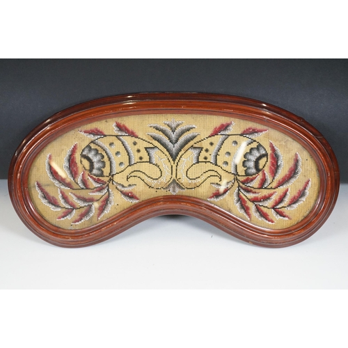 138 - Late 19th Century Victorian mahogany framed beadwork with four wooden bun feet and glazed top in the... 