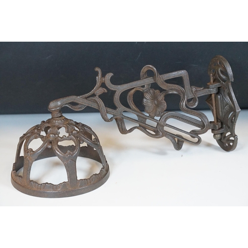 159 - Art nouveau late 19th century pierced iron wall bracket of foliate sinuous design, stamped with a re... 