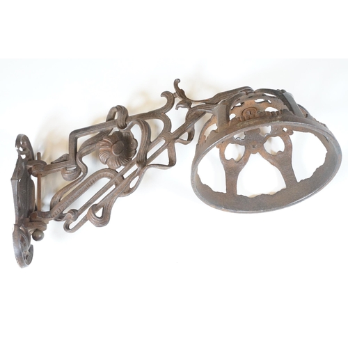 159 - Art nouveau late 19th century pierced iron wall bracket of foliate sinuous design, stamped with a re... 