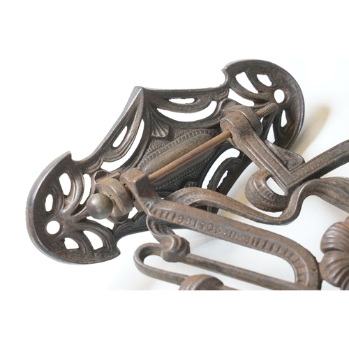 159 - Art nouveau late 19th century pierced iron wall bracket of foliate sinuous design, stamped with a re... 
