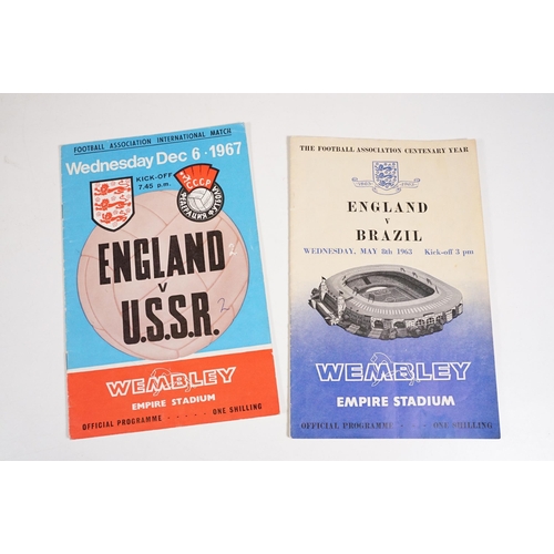 407 - Collection of 1960s football programmes and later football books to include International examples