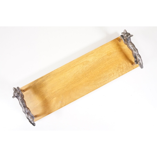 152 - Wooden bookstand with cast metal supports in the form of running foxes, on four ball feet, 44cm long