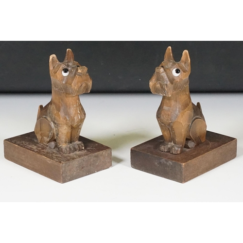 155 - Pair of Art Deco wooden carved ‘Scottie Dog ‘ bookends, with glass eyes, 15cm high