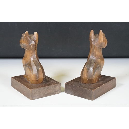 155 - Pair of Art Deco wooden carved ‘Scottie Dog ‘ bookends, with glass eyes, 15cm high