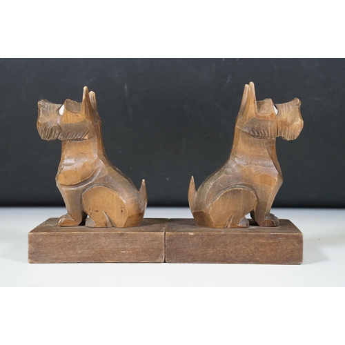 155 - Pair of Art Deco wooden carved ‘Scottie Dog ‘ bookends, with glass eyes, 15cm high