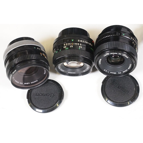 441 - Collection of cameras, lenses and equipment contained within a padded case to include Canon A-1 35mm... 