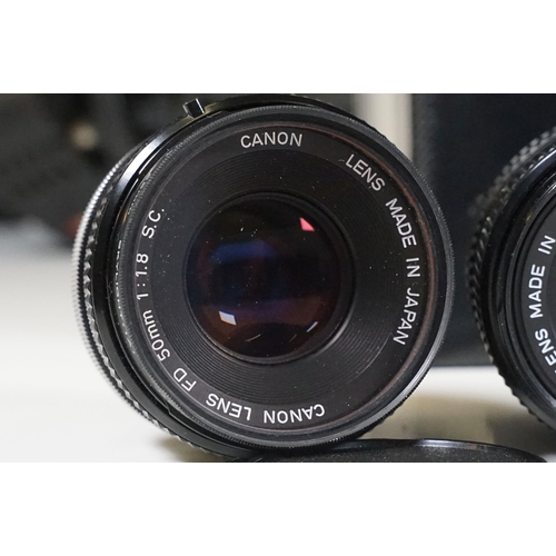 441 - Collection of cameras, lenses and equipment contained within a padded case to include Canon A-1 35mm... 