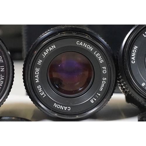 441 - Collection of cameras, lenses and equipment contained within a padded case to include Canon A-1 35mm... 