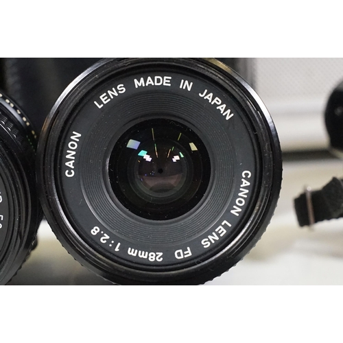 441 - Collection of cameras, lenses and equipment contained within a padded case to include Canon A-1 35mm... 