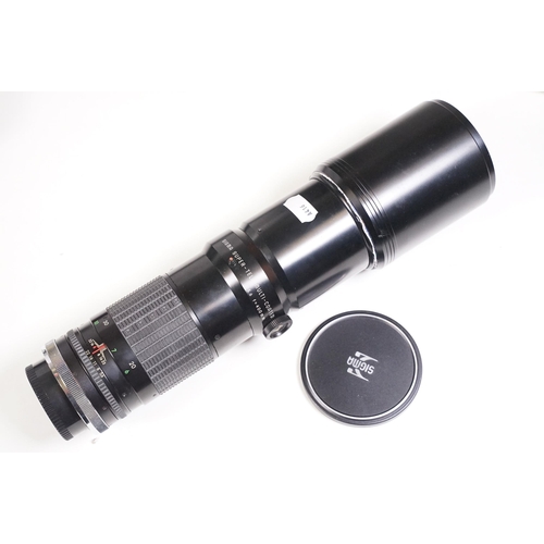 441 - Collection of cameras, lenses and equipment contained within a padded case to include Canon A-1 35mm... 