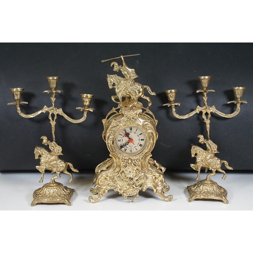 419 - Brass reproduction mantle clock together with matching candelabras