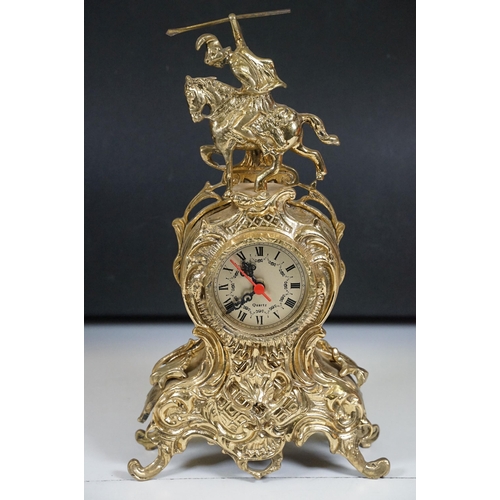 419 - Brass reproduction mantle clock together with matching candelabras