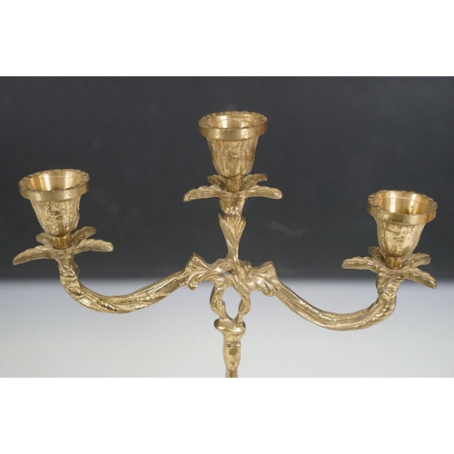 419 - Brass reproduction mantle clock together with matching candelabras