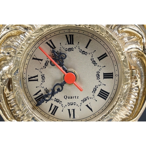 419 - Brass reproduction mantle clock together with matching candelabras