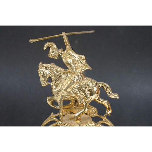 419 - Brass reproduction mantle clock together with matching candelabras