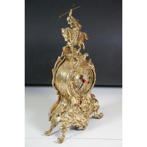 419 - Brass reproduction mantle clock together with matching candelabras