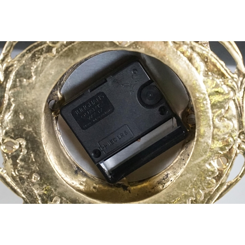 419 - Brass reproduction mantle clock together with matching candelabras