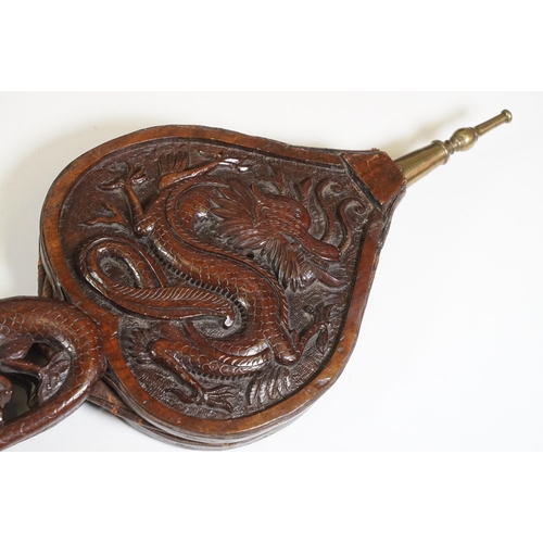 420 - Hand carved wooden Oriental fire bellows with dragon decoration