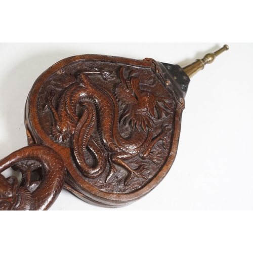 420 - Hand carved wooden Oriental fire bellows with dragon decoration