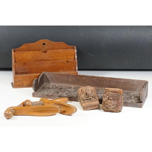 421 - Collection of treen items to include Early 20th Century Edwardian letter rack, pair of carved lion h... 