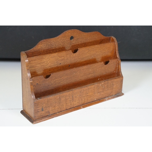 421 - Collection of treen items to include Early 20th Century Edwardian letter rack, pair of carved lion h... 