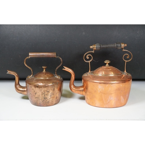 424 - Two Late 19th Century copper teapots, one with turned wooden handle