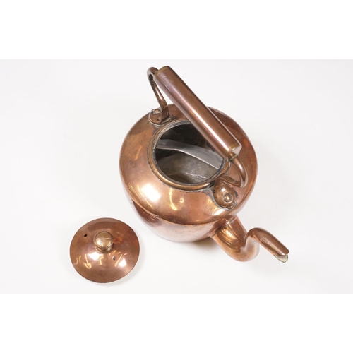 424 - Two Late 19th Century copper teapots, one with turned wooden handle