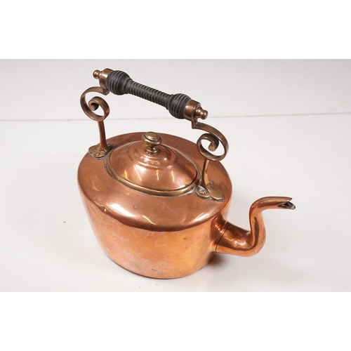 424 - Two Late 19th Century copper teapots, one with turned wooden handle