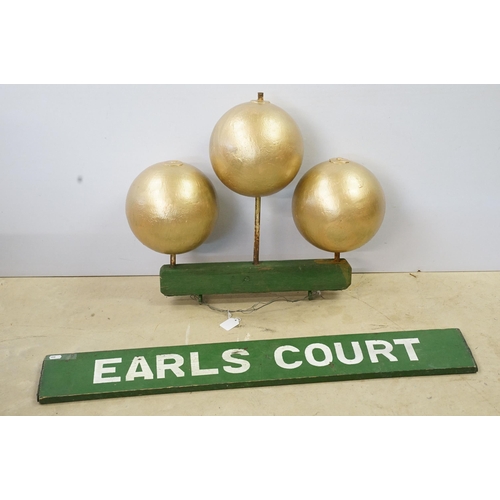 466 - 1950s pawn brokers painted glass golden balls on wooden hanger, together with a painted District Lin... 