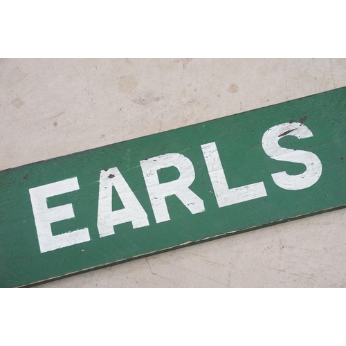 466 - 1950s pawn brokers painted glass golden balls on wooden hanger, together with a painted District Lin... 