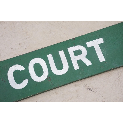 466 - 1950s pawn brokers painted glass golden balls on wooden hanger, together with a painted District Lin... 