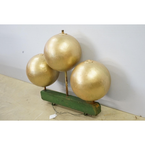 466 - 1950s pawn brokers painted glass golden balls on wooden hanger, together with a painted District Lin... 