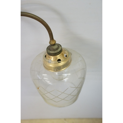 469 - Three early 20th Century rise and fall hall lights, each having two scrolled arms with cut glass sco... 