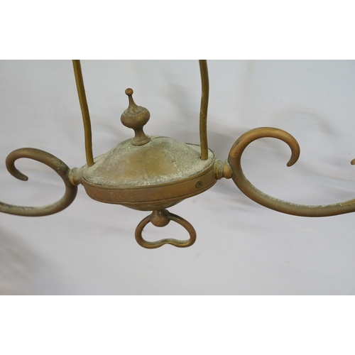 469 - Three early 20th Century rise and fall hall lights, each having two scrolled arms with cut glass sco... 