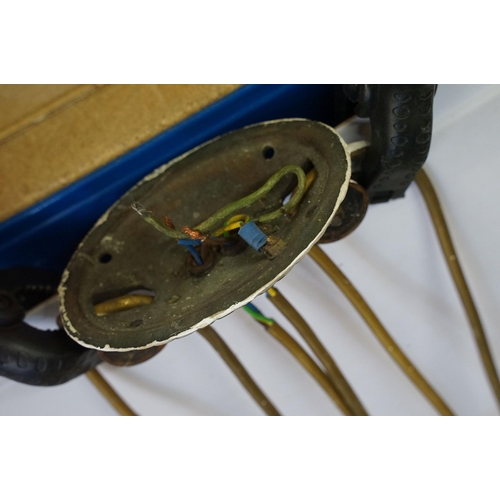 469 - Three early 20th Century rise and fall hall lights, each having two scrolled arms with cut glass sco... 