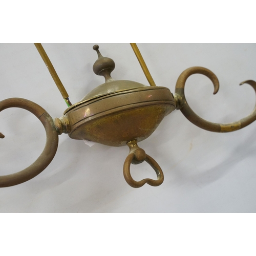 469 - Three early 20th Century rise and fall hall lights, each having two scrolled arms with cut glass sco... 