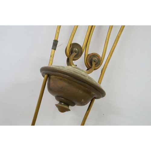 469 - Three early 20th Century rise and fall hall lights, each having two scrolled arms with cut glass sco... 