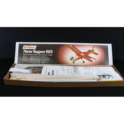 310 - Six boxed Radio Controlled model kit aircrafts to include Keil Kraft New Super 60 Radio Control Trai... 