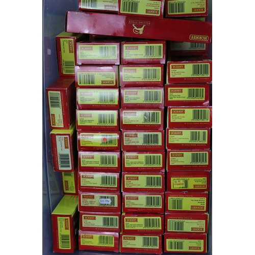 136 - 69 Boxed Hornby OO gauge items of rolling stock to include R6484 KFA Container Wagon 93478, R4235 BE... 