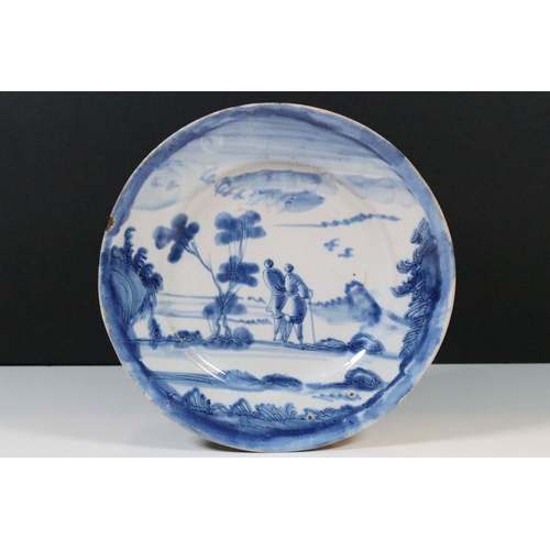 12 - 18th century delft ware plate with blue and white design of a walking couple within a scenic view, d... 