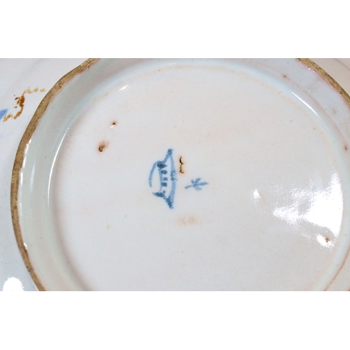 12 - 18th century delft ware plate with blue and white design of a walking couple within a scenic view, d... 