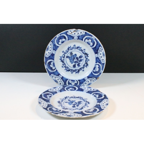 13 - Pair of 18th century delft blue and white plates with floral decoration, diameter approx. 23.5cm